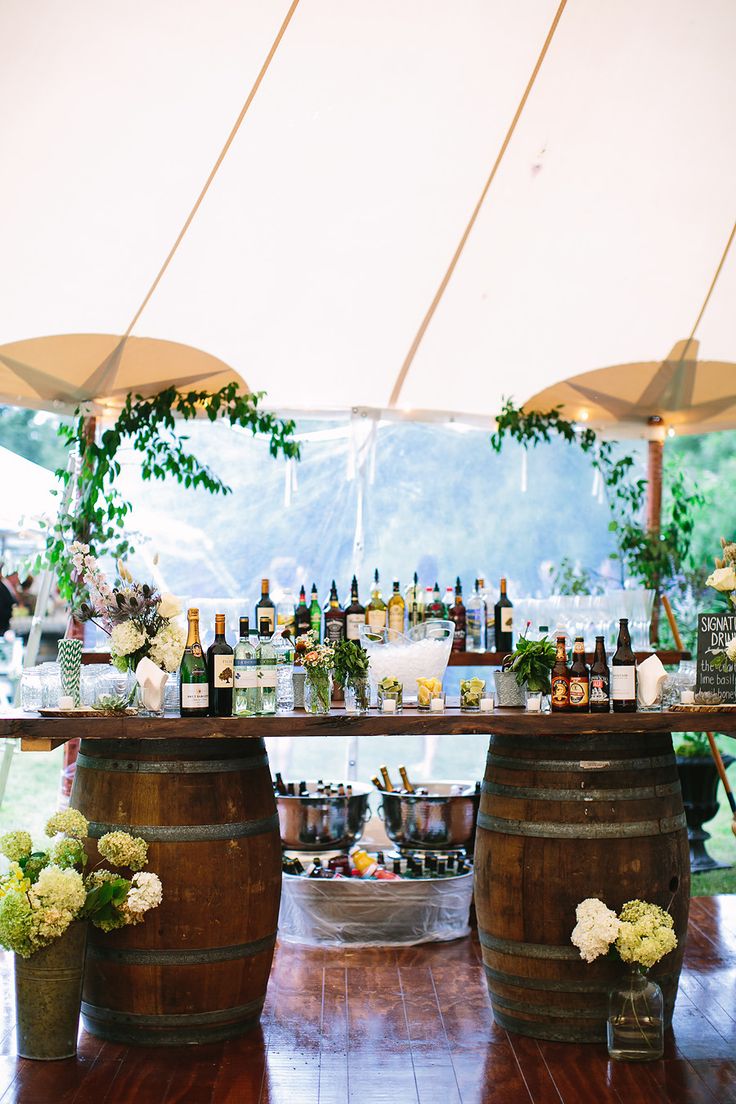 A well arranged bottles and drinks on a bar