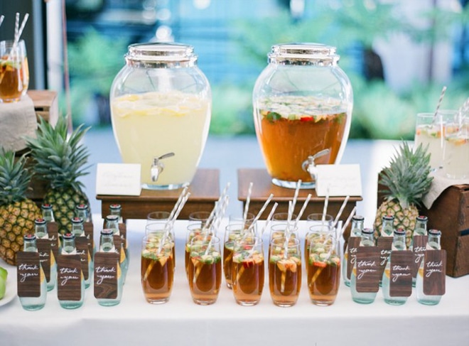 A bar with colored summer drinks