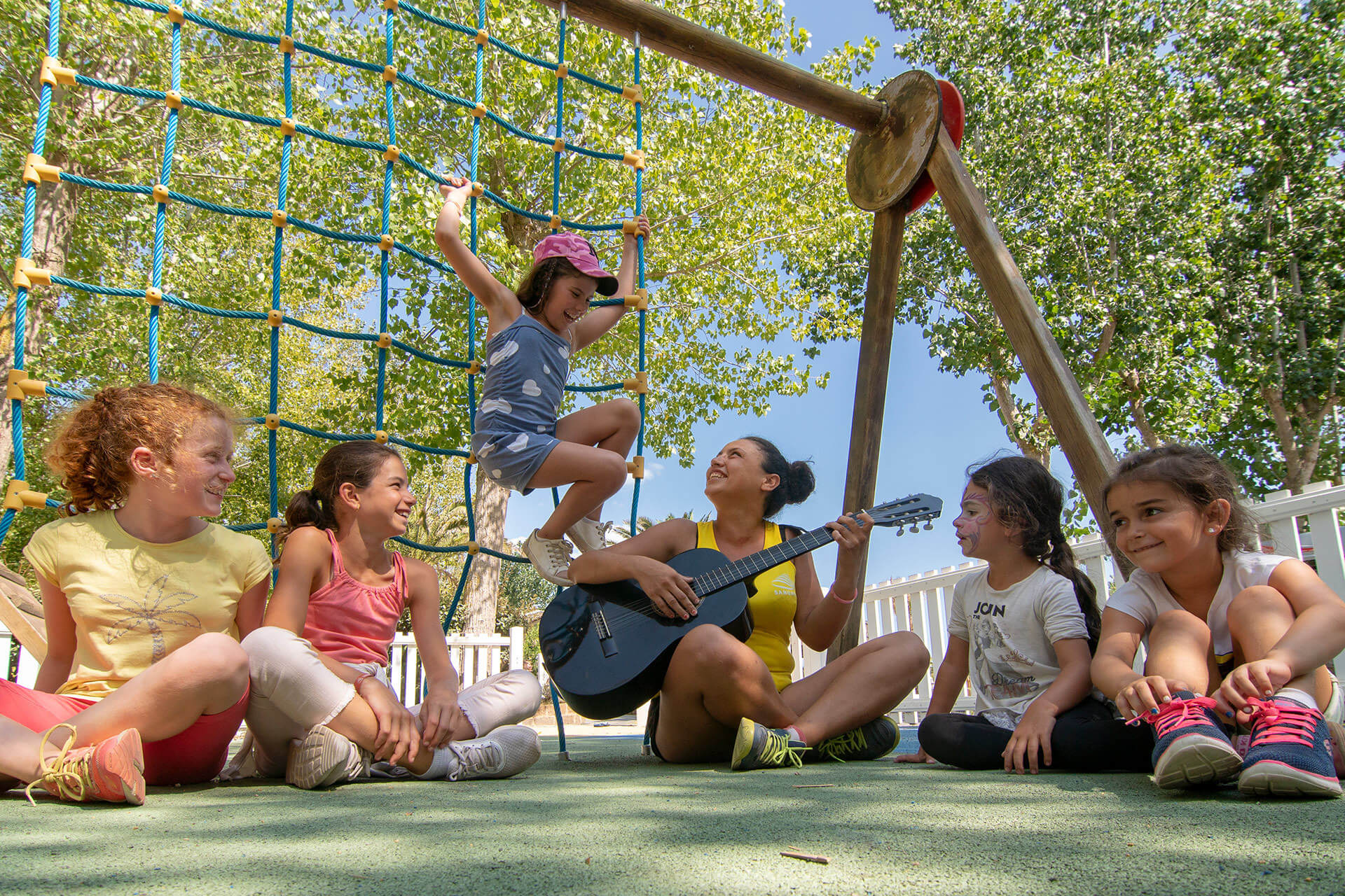 Children playing near a playground structure
